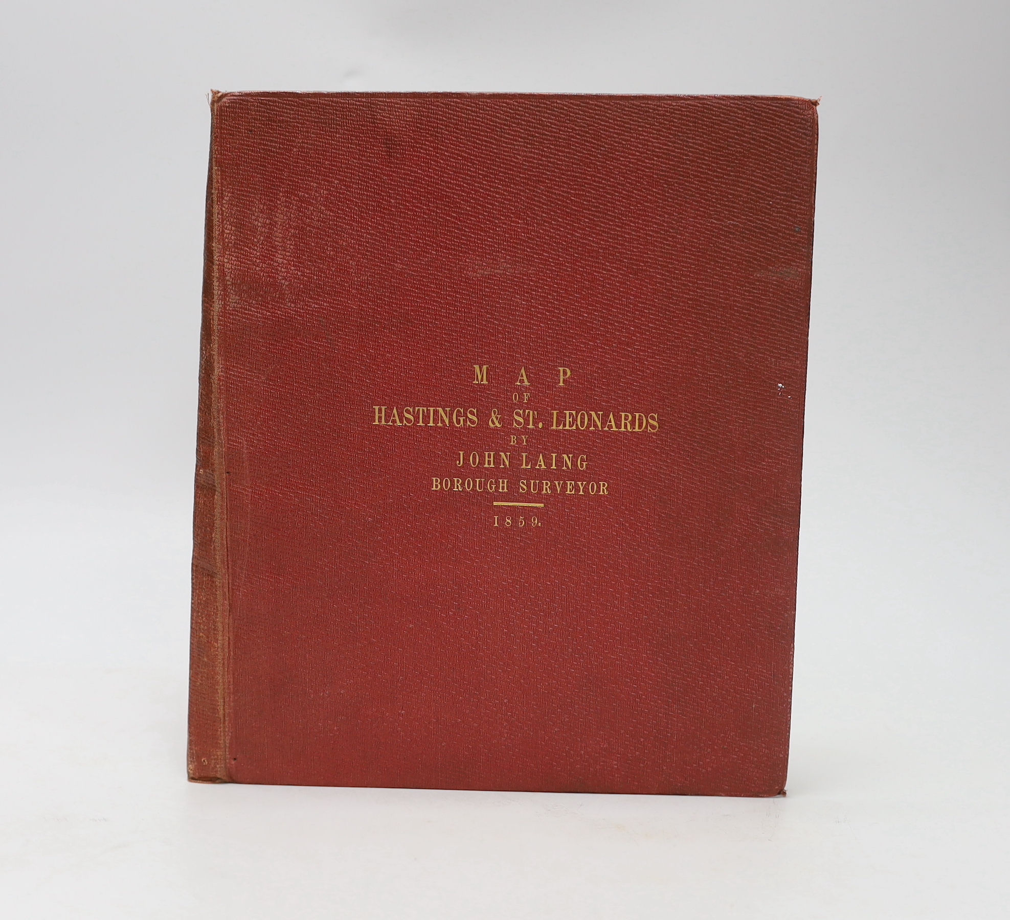 HASTINGS - Laing, John (Borough Surveyor) - Map of Hastings and St. Leonards, on linen in red cloth binding with gilt lettering, scale: 12 inches to 1 mile, Hastings, January 1859, 68.5 x 131cms